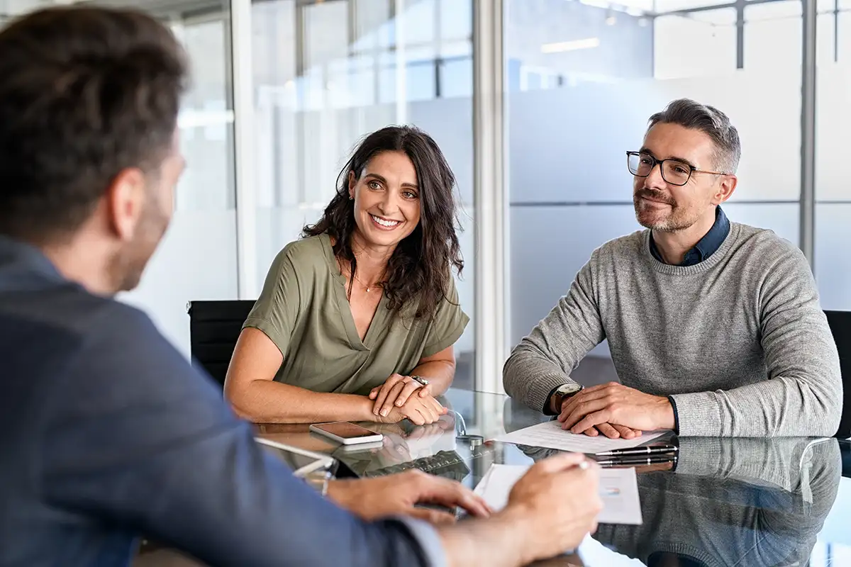 A couple at a table with a tax lawyer